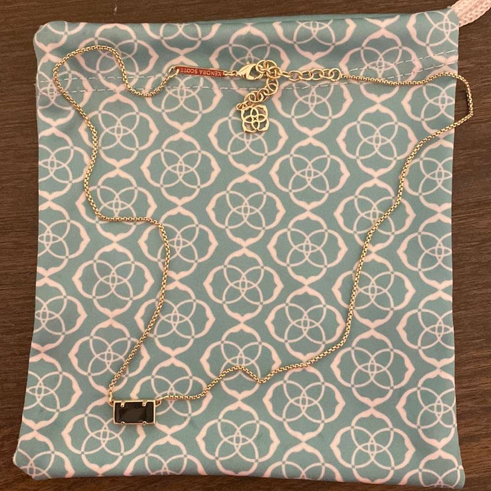 Kendra Scott black and gold necklace. Only worn once. (comes with dust bag)